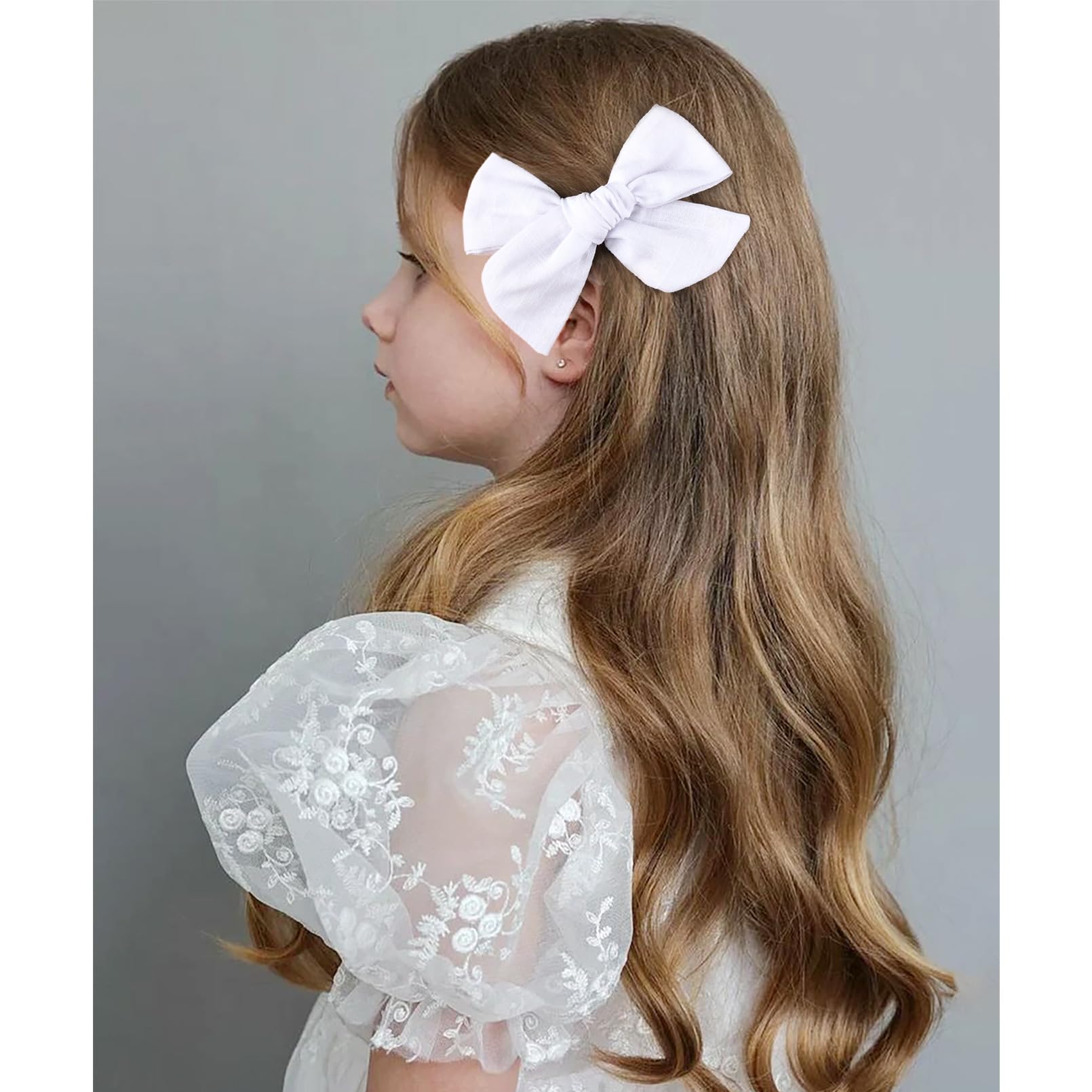 DEEKA fashion-ready bows on a hairstyle; coordinates with uniforms