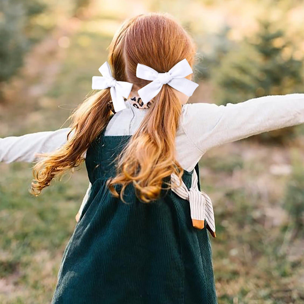 DEEKA bow worn by a little girl; comfy all-day wear for school