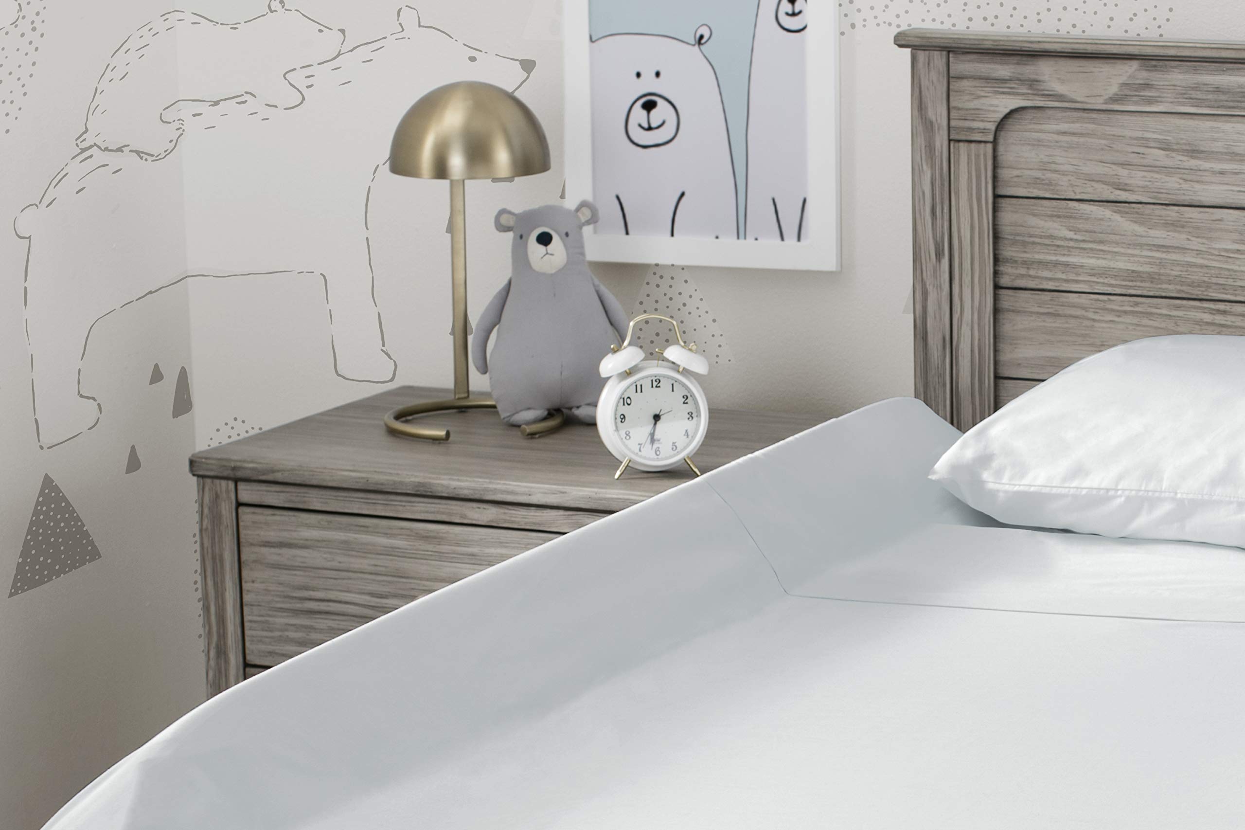 Delta Children bedrail installs quickly by slipping under a fitted sheet.