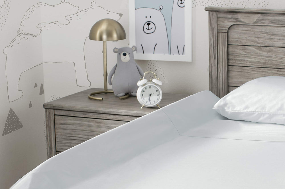 Delta Children bedrail installs quickly by slipping under a fitted sheet.