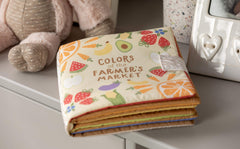 DEMDACO Farmers Market Bright Colors fabric texture highlights soft touch for soothing baby interaction.