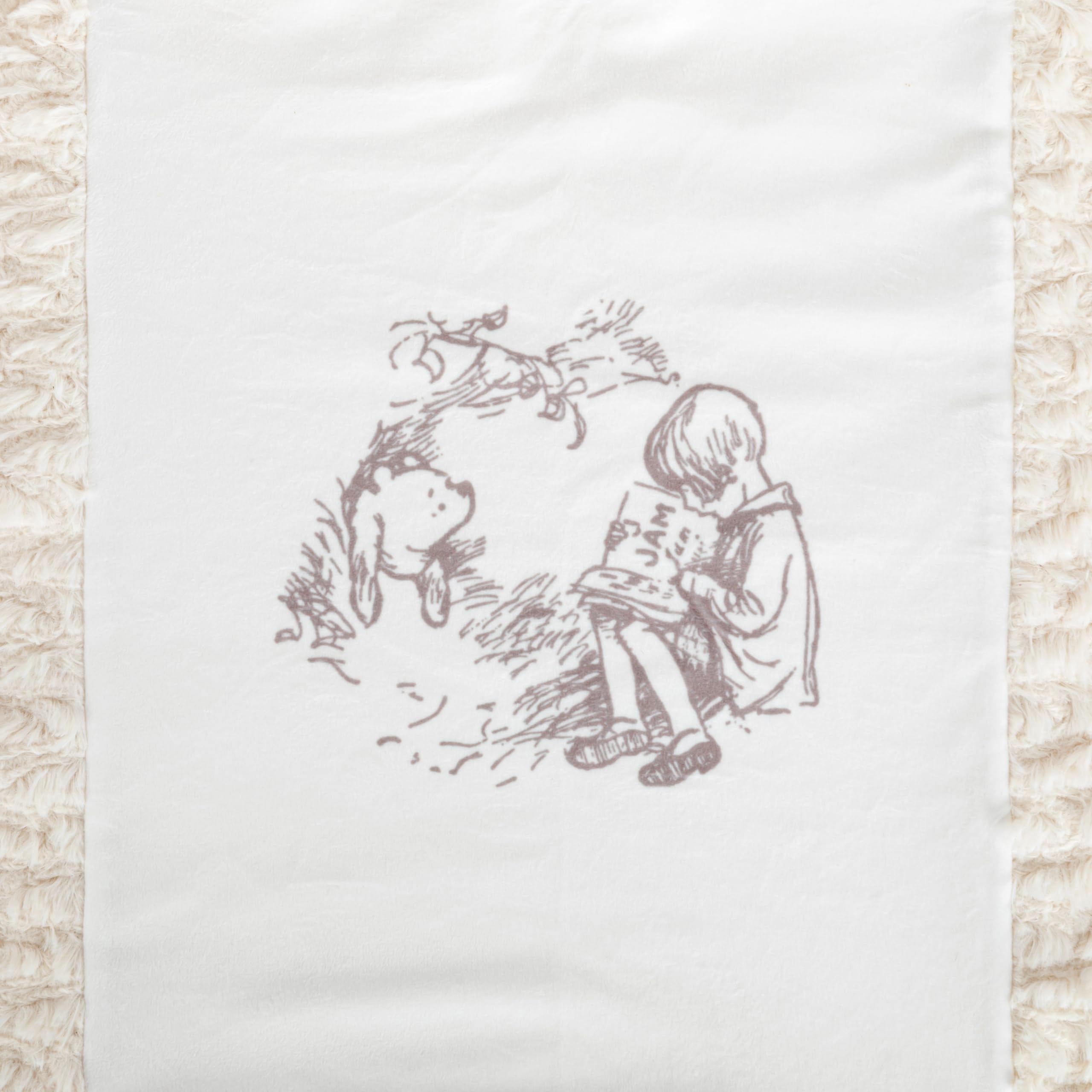 DEMDACO Pooh Classic Yellow Bear blanket close-up of soft cotton-poly fabric for gentle warmth.