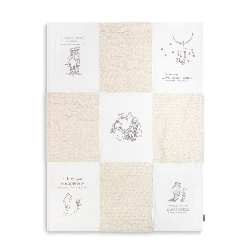 DEMDACO Pooh Classic Yellow Bear blanket folded for easy, cozy on-the-go comfort.