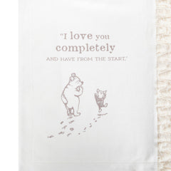 DEMDACO Pooh Classic Yellow Bear blanket packaging, ready for gifting at baby showers.