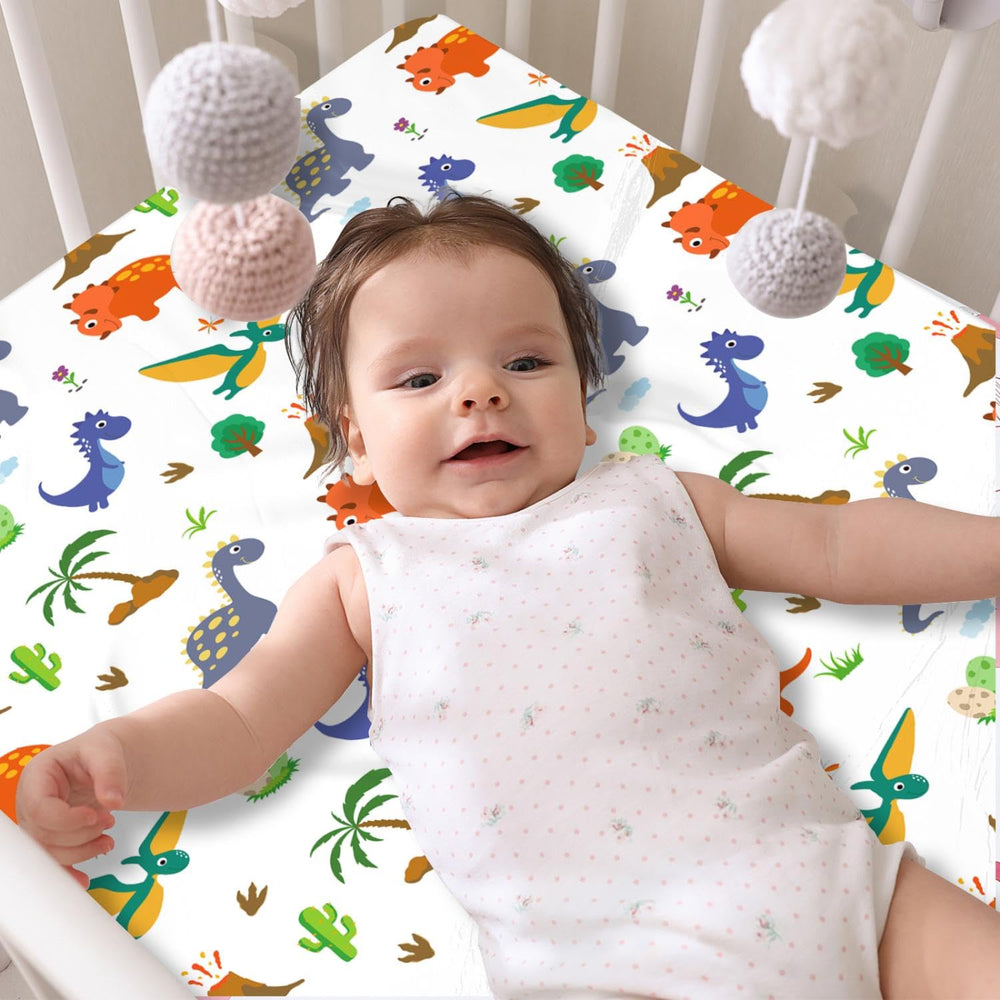 DengFengLai dinosaur pattern crib sheet close-up showing soft microfiber texture.