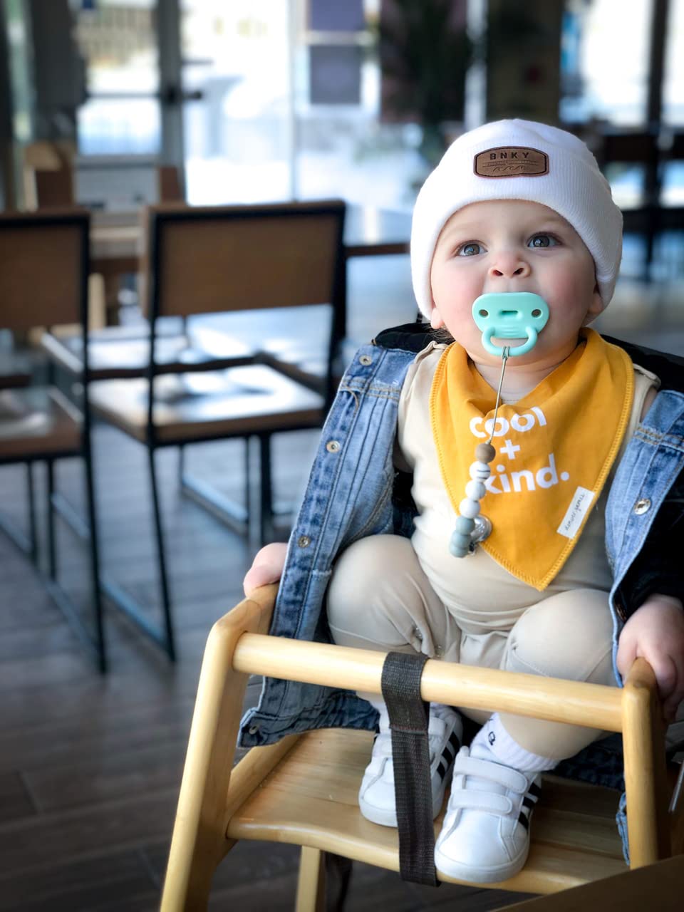 Denver James bib at mealtime; keeps clothes cleaner during spills and drips.