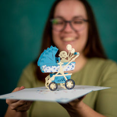 Devine Popup Cards congratulations baby card features celebratory colors and friendly motifs