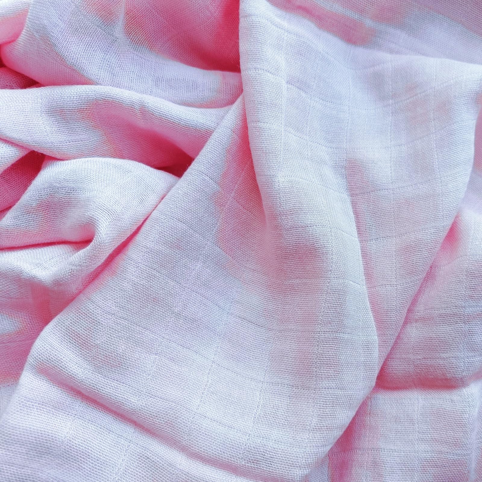 DEZIGKA muslin swaddle closeup highlighting velvety-soft fabric quality