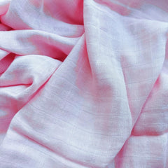 DEZIGKA muslin swaddle closeup highlighting velvety-soft fabric quality