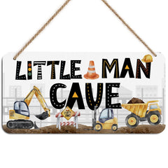 DHKG Little Man Cave Sign hangs on a wooden door adding playful nursery decor