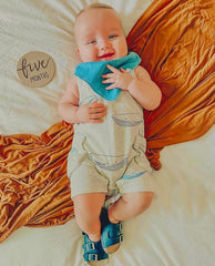 Diaper Squad 3-snap adjustable bibs demonstrating growing fit from newborn to toddlers