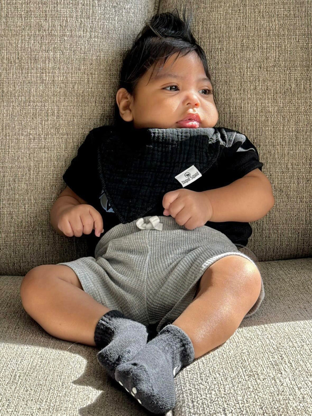 Diaper Squad bandana bibs showcase stylish designs for mix-and-match outfits during teething.