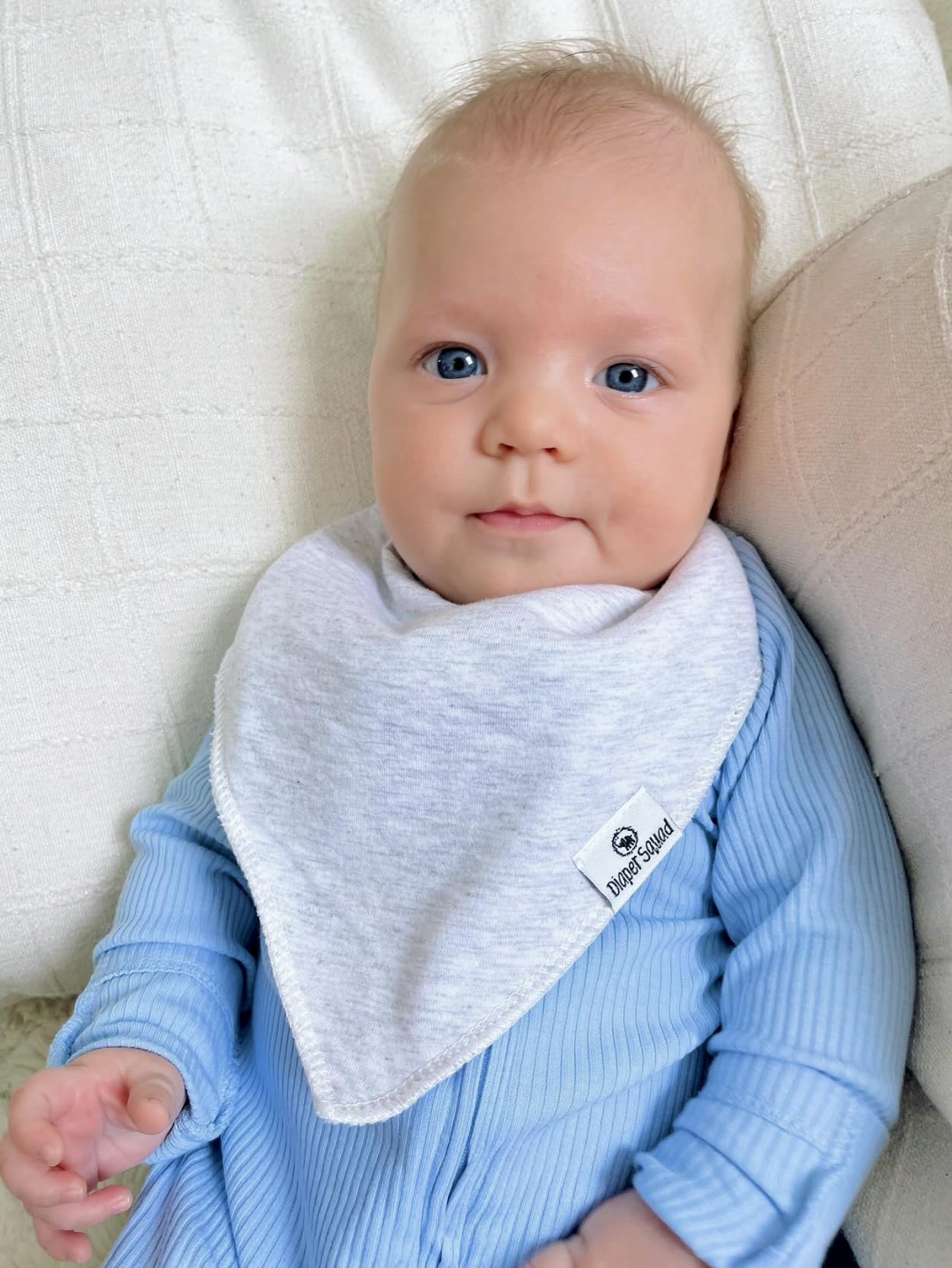 Diaper Squad bib double-layer fabric enhances absorption for heavy drool days.