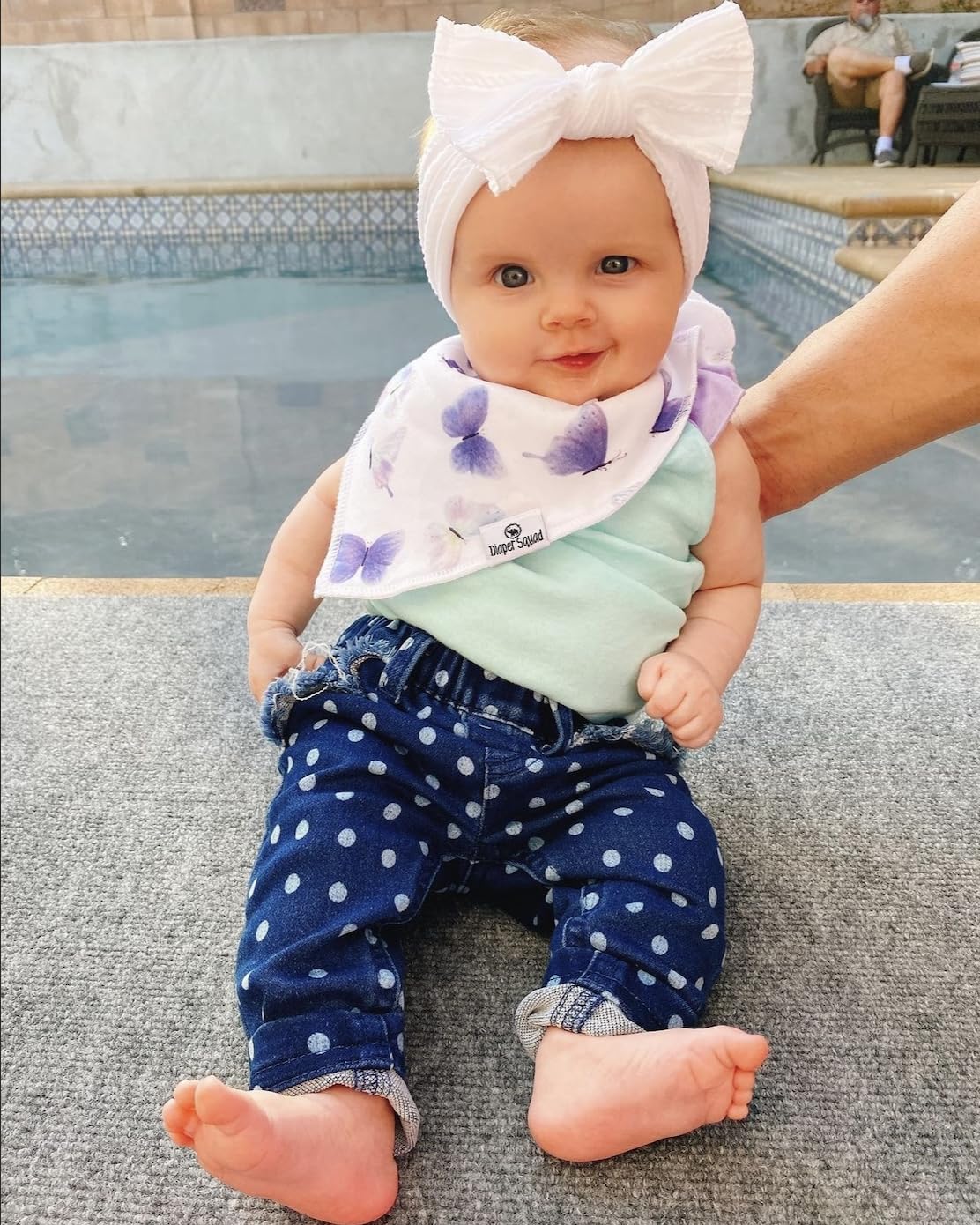 Diaper Squad bibs close-up with adjustable three-snap system for growing babies.