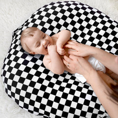 DILIMI lounger cover features a convenient handle for portable nursery use.