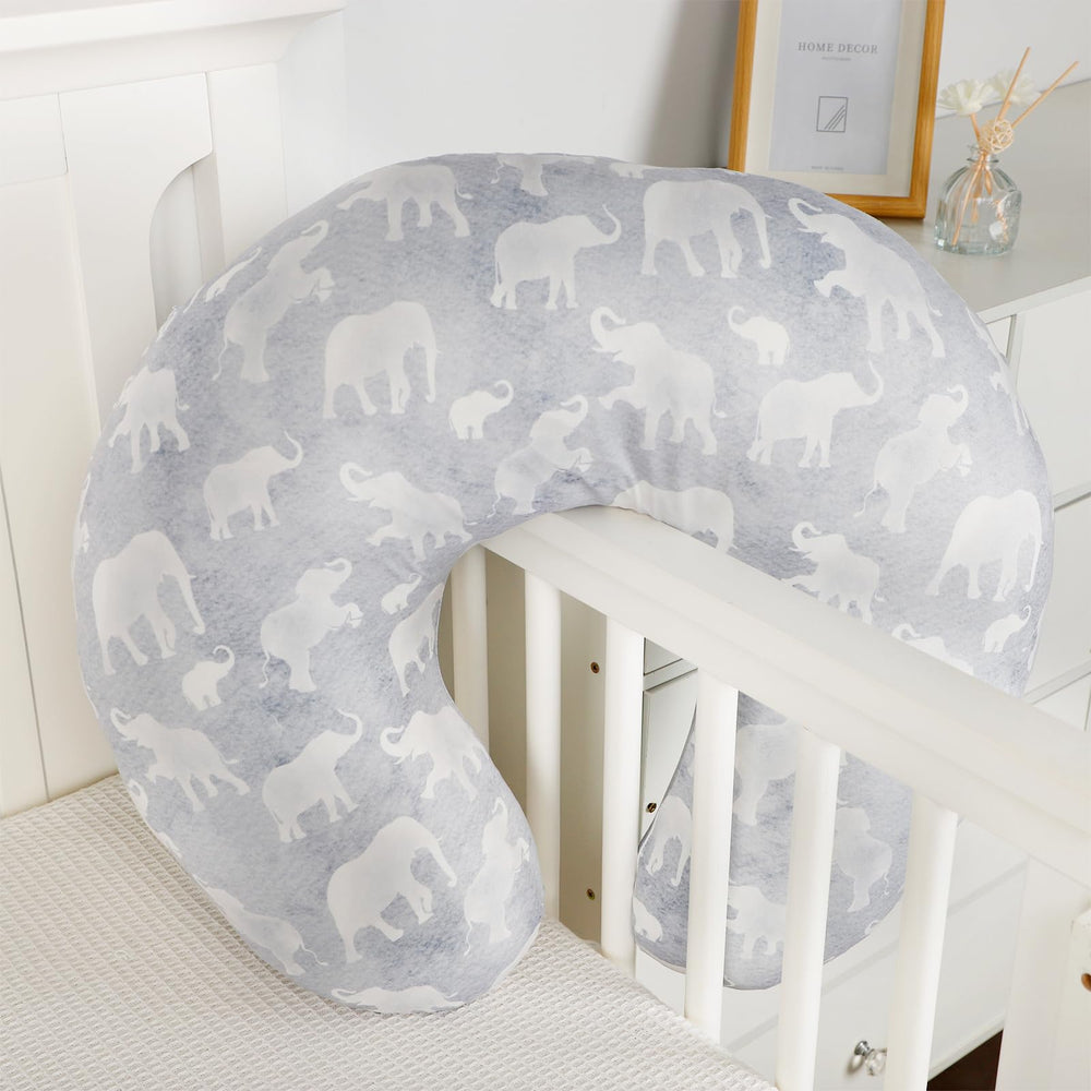 DILIMI nursing pillow cover shown on a bed for stylish nursery look.