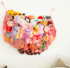 Diocos boho nursery hanging storage enhances decor while keeping toys tidy.
