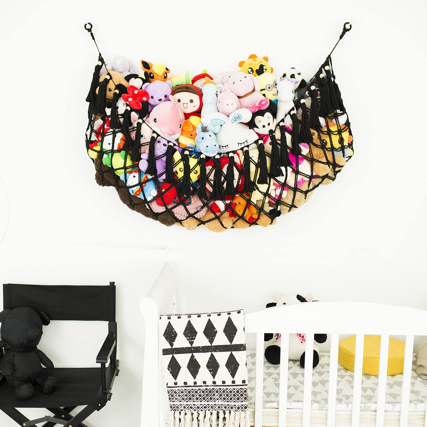 Diocos macrame toy hammock with tassels provides stylish boho nursery organization.