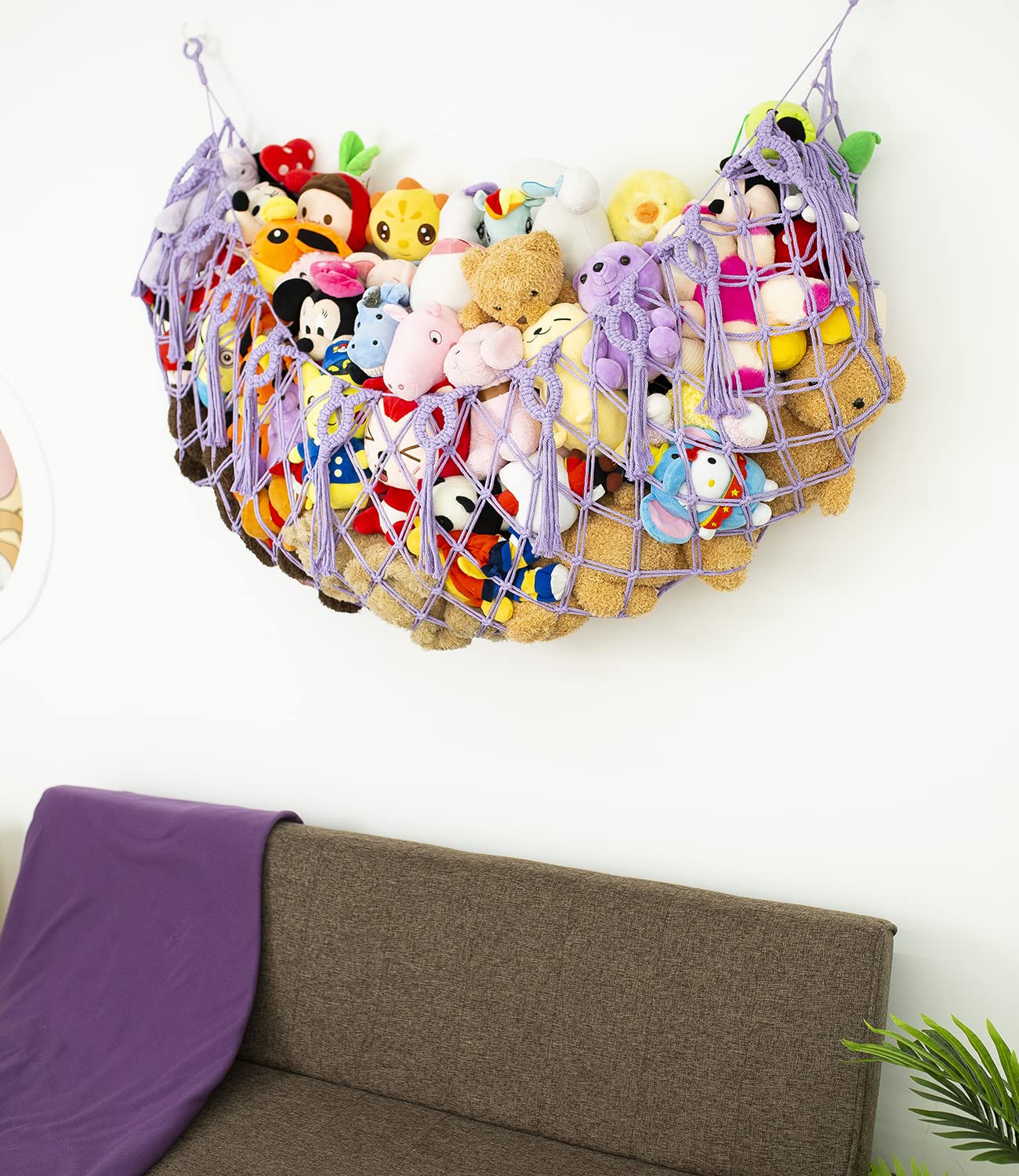 Diocos purple macrame hammock showcases plush collection in style and practicality.