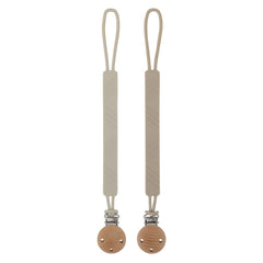 Dirbabi silicone pacifier clip holder in sand color keeps pacifier clean and close.
