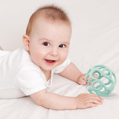 Dirbabi silicone teething ball side grip demonstrates secure hold during play.