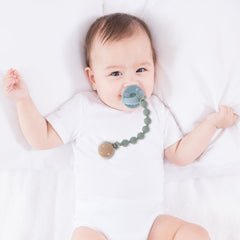 Dirbabi two-in-one pacifier holder demonstrates compact, hands-free design to keep essentials close