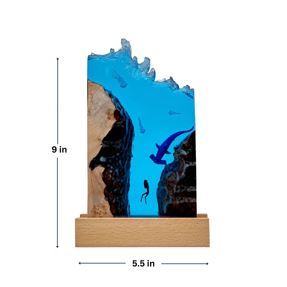DiscoverSharks ocean night light radiates a soft glow from the base, ideal for desk or shelf accent.