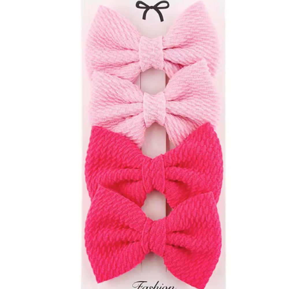 Dnett Designs toddler hair bows clip-secure hold during active play.