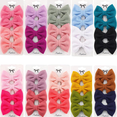 Dnett Designs waffle bow 3in with alligator clip provides secure daily wear.