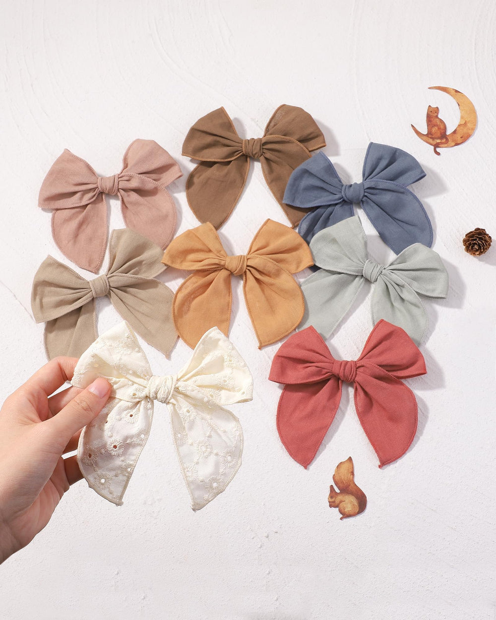 Doboi beige cutout hair clip adds coordinated, stylish detail