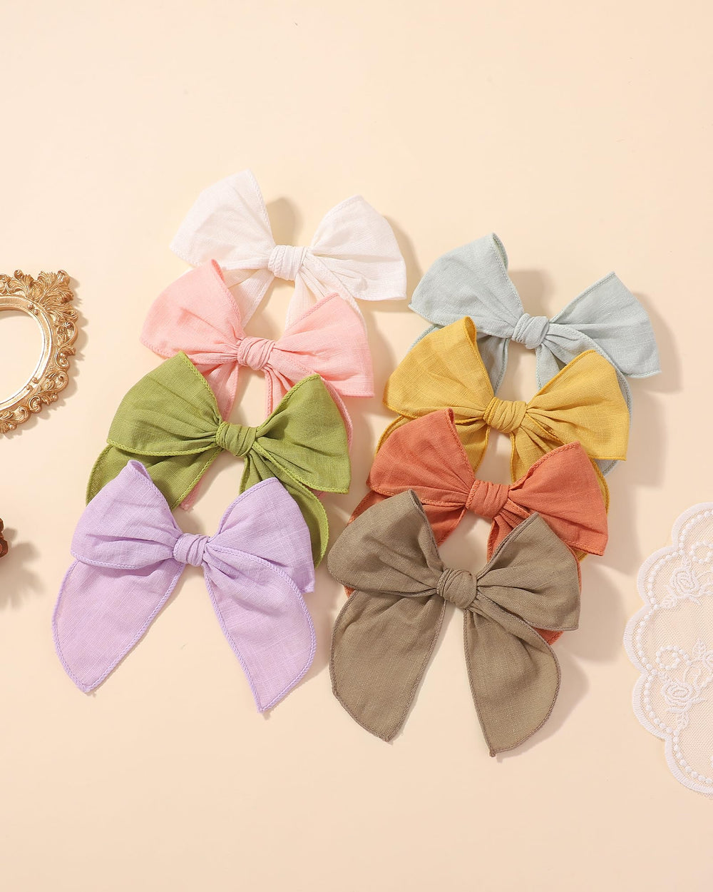 doboi flatlay of 8 color bows and accessories