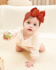 doboi newborn-to-toddler headband offers stretchy nylon for growing kids.