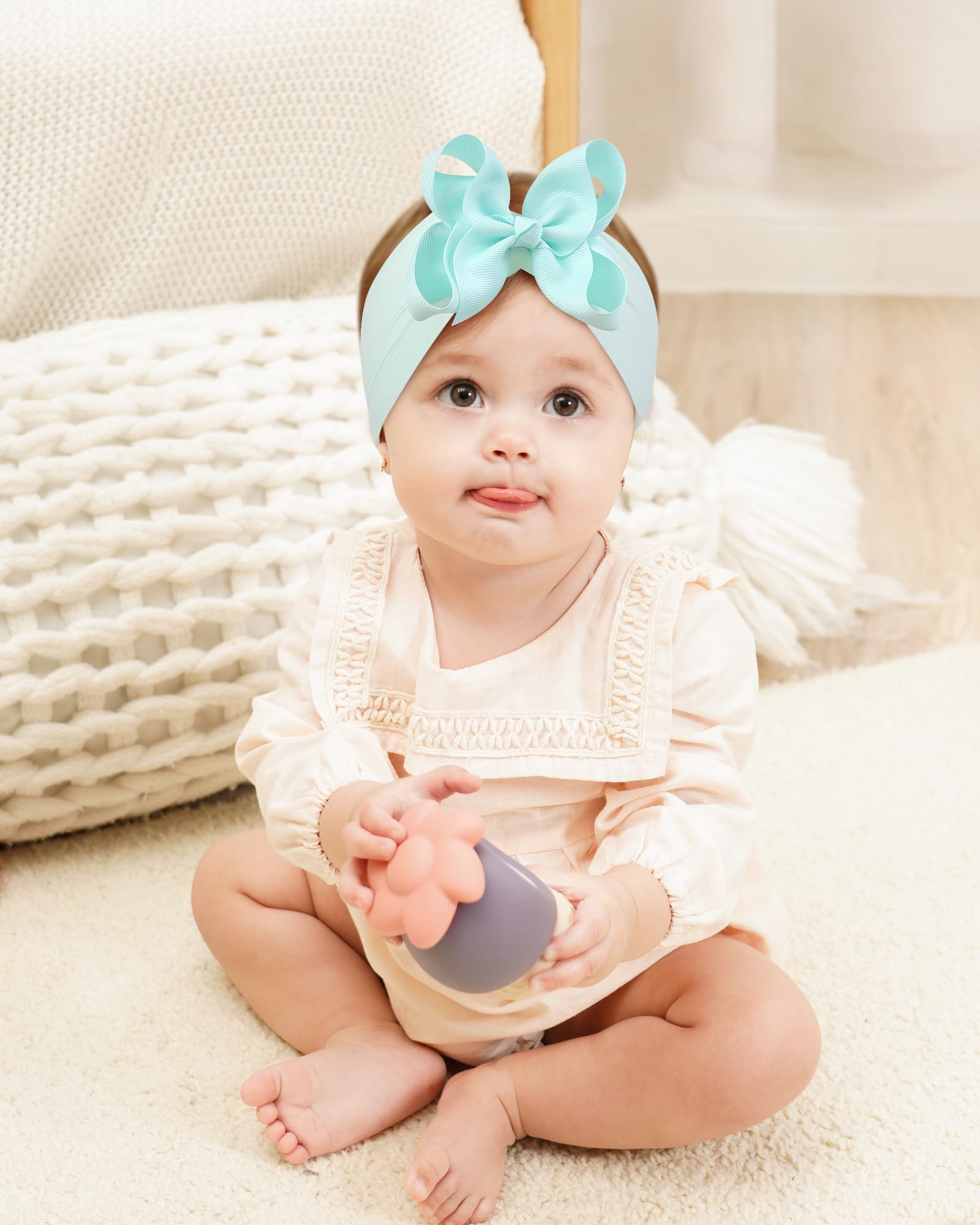 doboi photoshoot-ready bows on baby girl illustrate stylish portrait accessory.