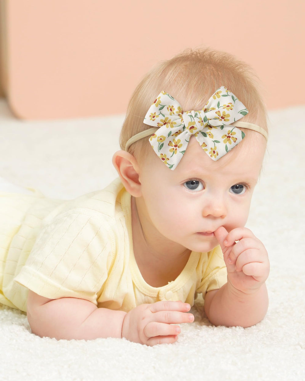 Doboi soft bow and headband set on baby wearing comfortable fabric for all-day wear.