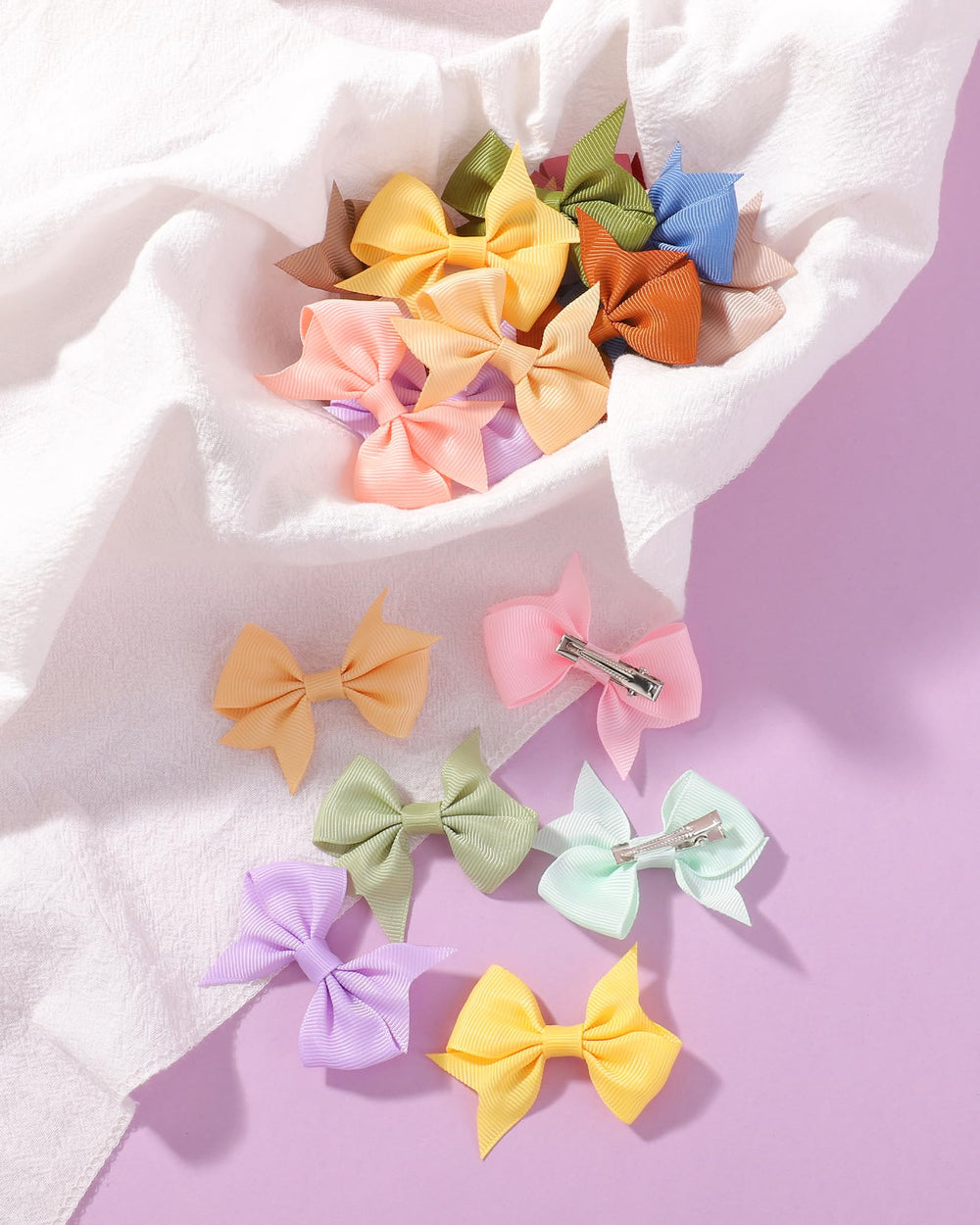 doboi soft ribbon bows offer a delicate accessory for newborns.