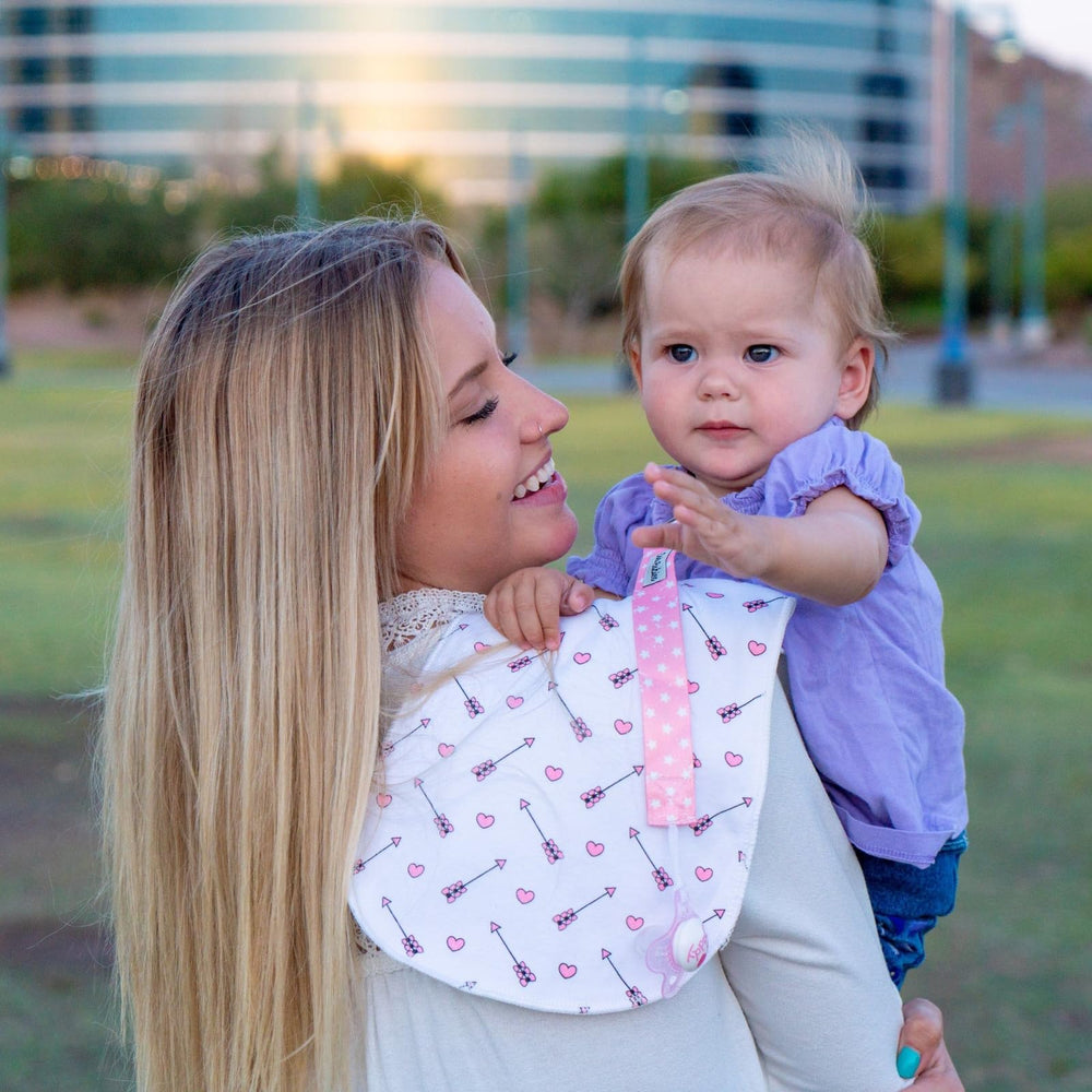 Pastel pacifier case keeps one clean and handy on a diaper bag.