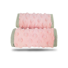 DODO NICI car seat strap cover solid pink provides soft padding for comfortable travel.