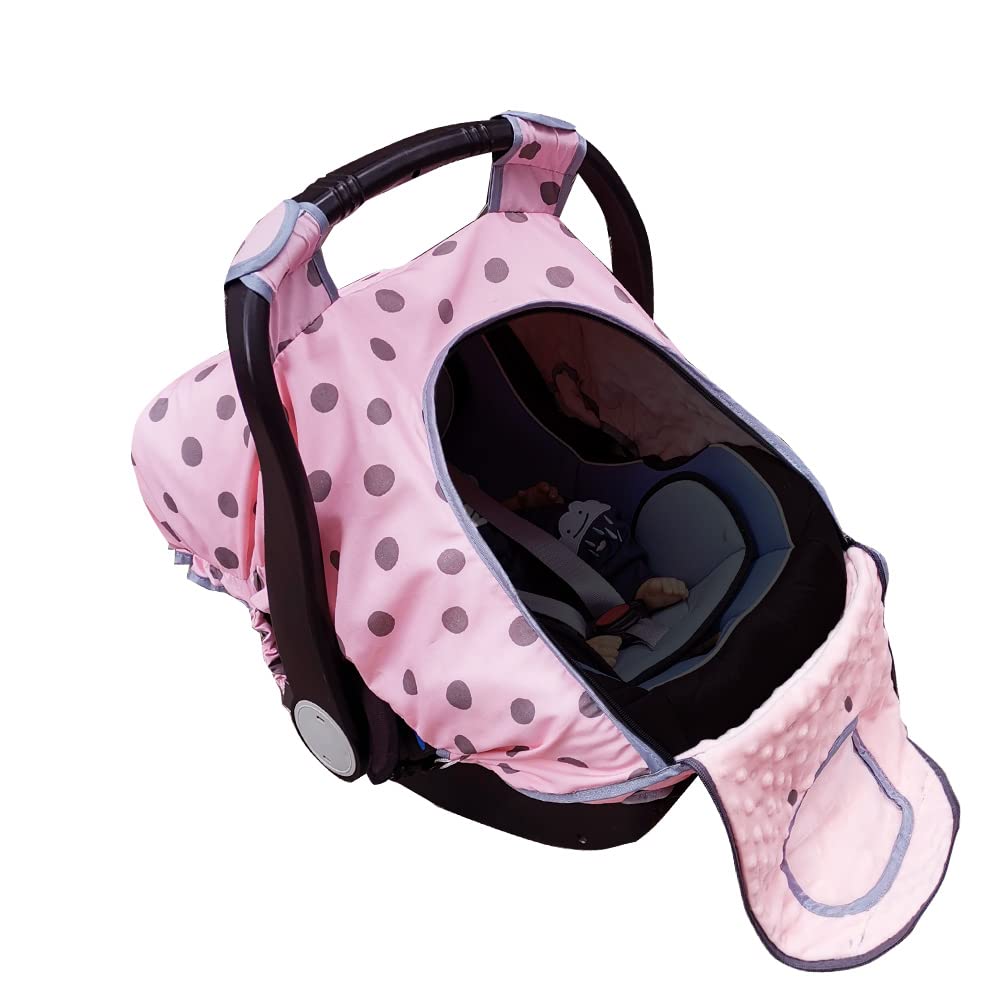 Dodo Nici carseat cover with pink dots on infant carrier for cozy warmth