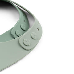 Done by Deer Croco Green silicone bib adjustable strap for secure, comfy fit.