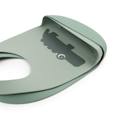 Done by Deer Croco Green silicone bib dishwasher-safe close-up shows easy cleanup.
