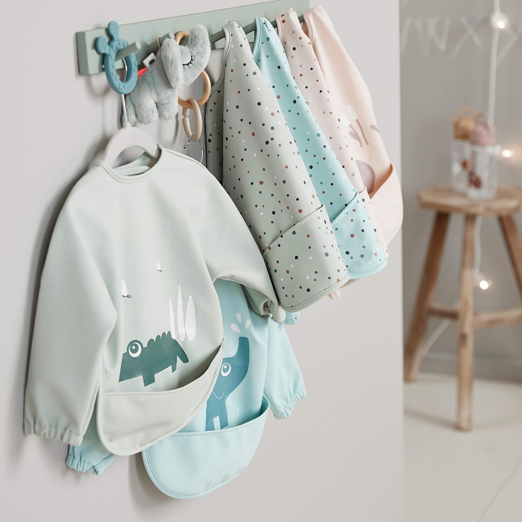 Done by Deer Croco print soft-green bib closeup for playful mealtimes