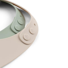 Done by Deer silicone bib in green with cactus print, supports mess-free meals and easy wipe-clean.