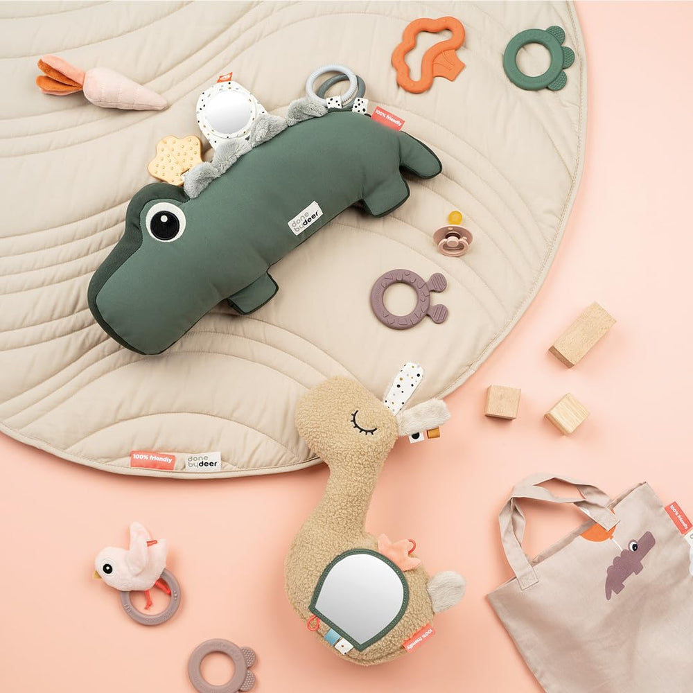 Done by Deer tummy time pillow jittering Croco tummy in action enhances playful exploration.