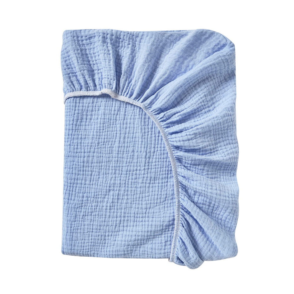 Donomilo changing pad cover on changing table demonstrates full coverage and soft fabric