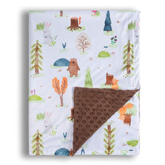 Donsonny forest bear blanket folded on bed shows cozy nap-time warmth.