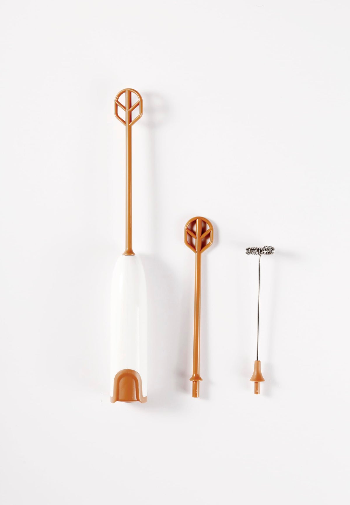 DOOBAANN formula mixer in-use with handheld grip for quick, bubble-free mixing.