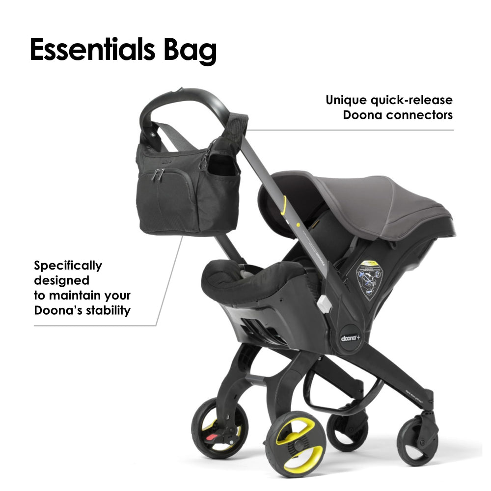 DOONA Essentials Bag Nitro Black close-up shows two-sided bottle holders for quick access.