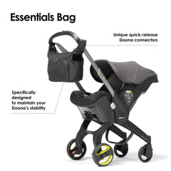 DOONA Essentials Bag Nitro Black close-up shows two-sided bottle holders for quick access.
