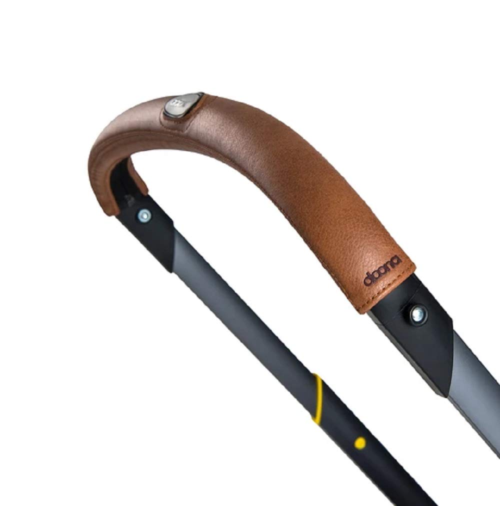 Doona handlebar cover in brown adds stylish grip and protective comfort during strolls.