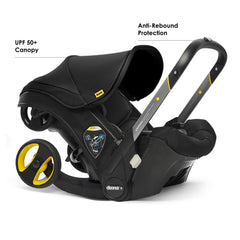 Doona Nitro Black stroller in action during a city outing